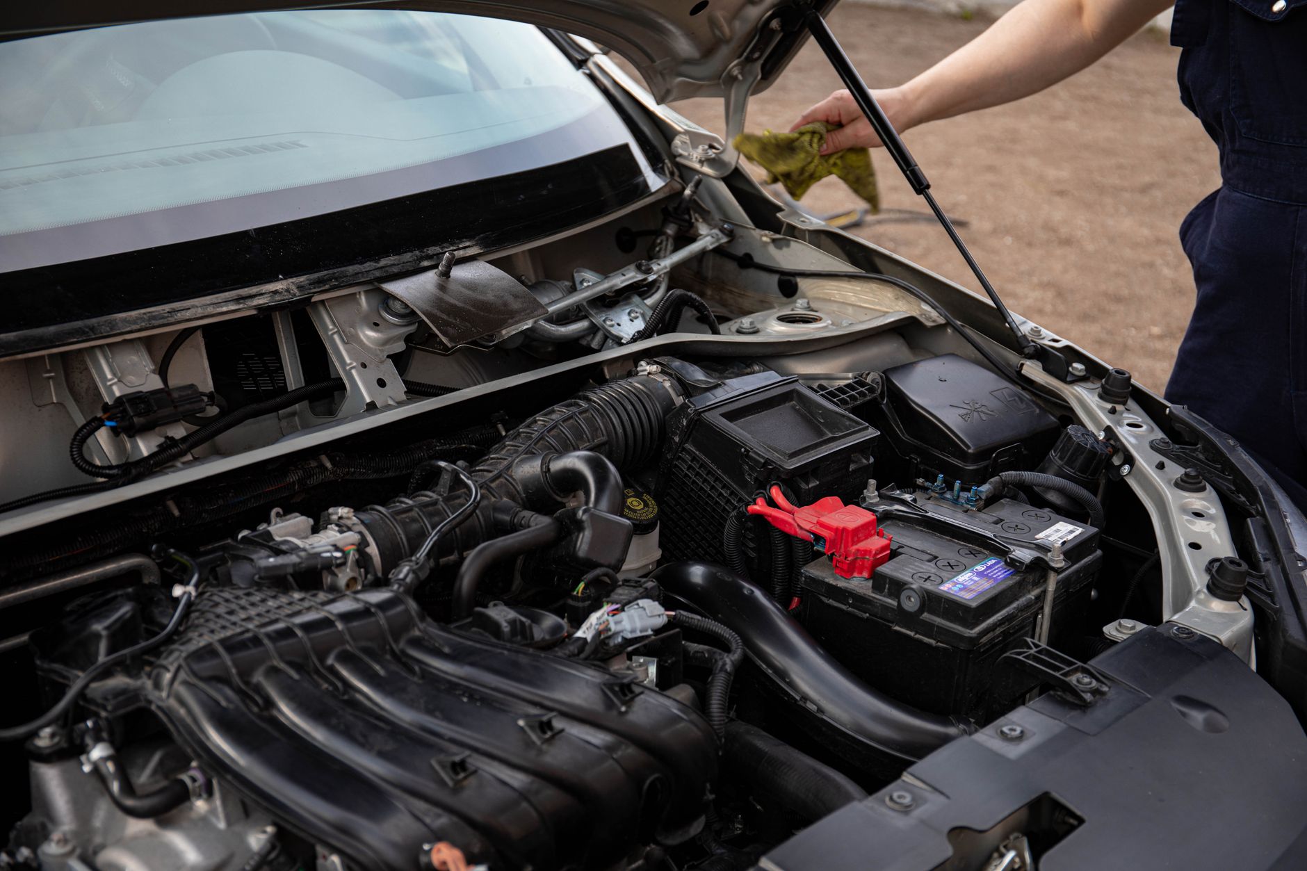 Car engine bay with the hood open during a service
