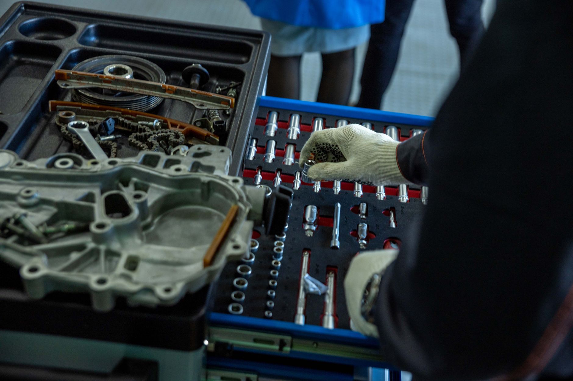 Transmission valve body parts laid out beside a tool tray