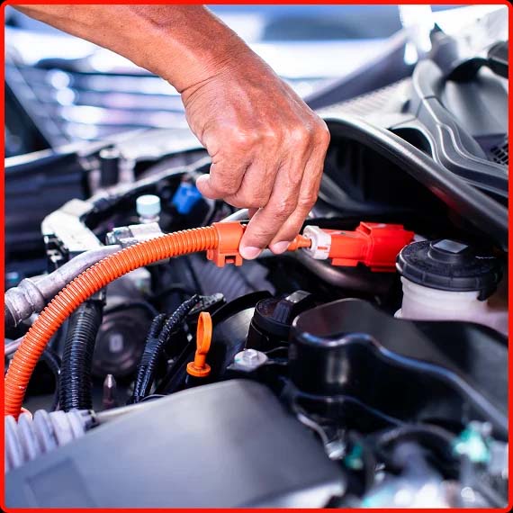 Mechanic inspecting a vehicle line for maintenance at Shift Masters Transmissions in Phoenix AZ