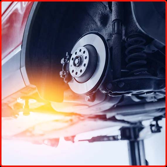 Close-up of car brake rotors being inspected and serviced at Shift Masters Transmissions in Phoenix AZ