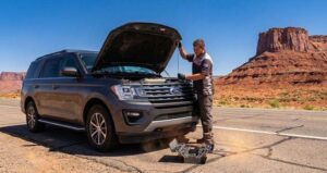 Car broken down on the side of the road with hood open in Phoenix AZ needing repair