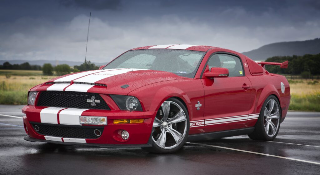 Red Ford Mustang GT500 leaving Shift Masters Transmissions after professional transmission repair and diagnostics in Phoenix, Arizona.