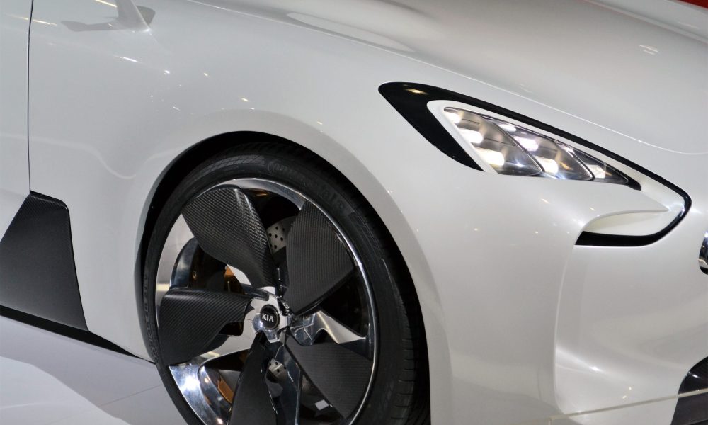 Custom Kia vehicle with carbon fiber wheels representing expert Kia transmission service and automotive care in Phoenix Arizona.