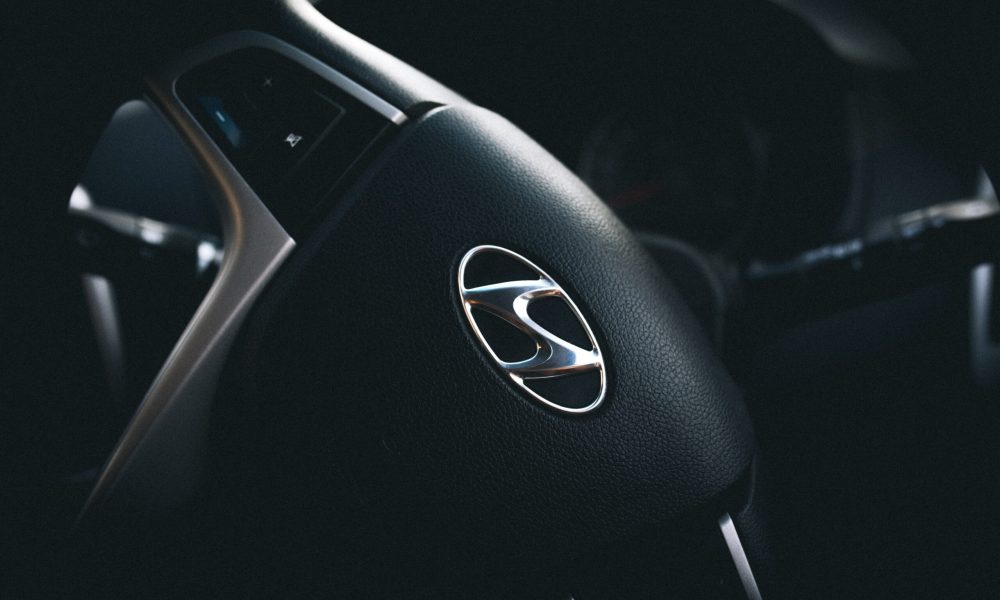 Clean black Hyundai vehicle interior with steering wheel representing professional Hyundai transmission service and automotive care in Phoenix Arizona.