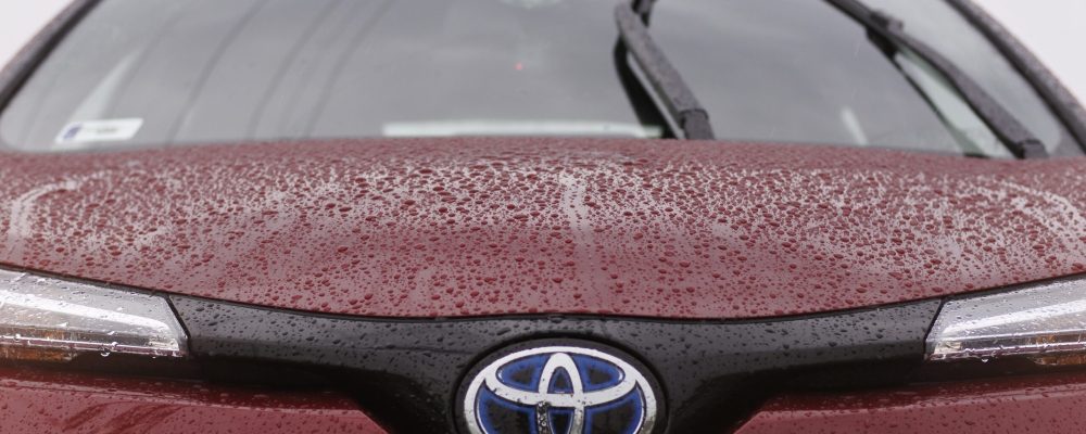 Front end view of a red Toyota vehicle at Shift Masters Transmissions in Phoenix Arizona receiving professional transmission diagnostics, inspection, and repair services.