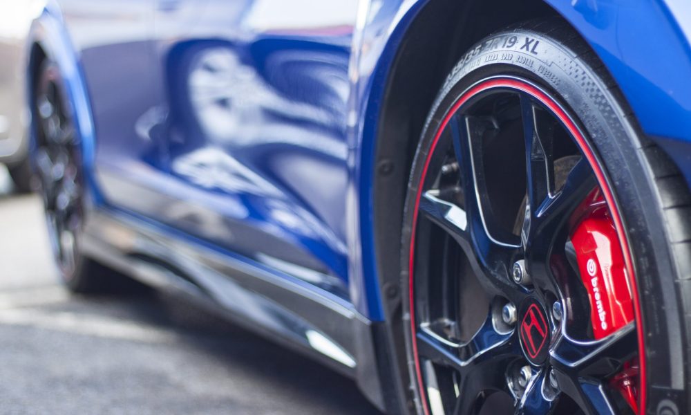 Blue Honda sport model with custom rims representing transmission service at Shift Masters Transmissions Phoenix Arizona